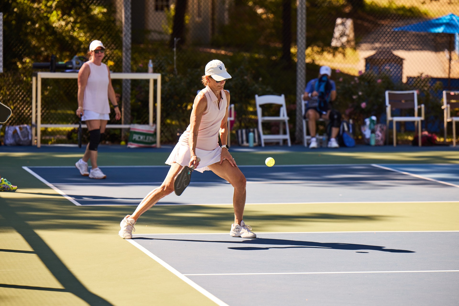 a woman playing tennis on a court