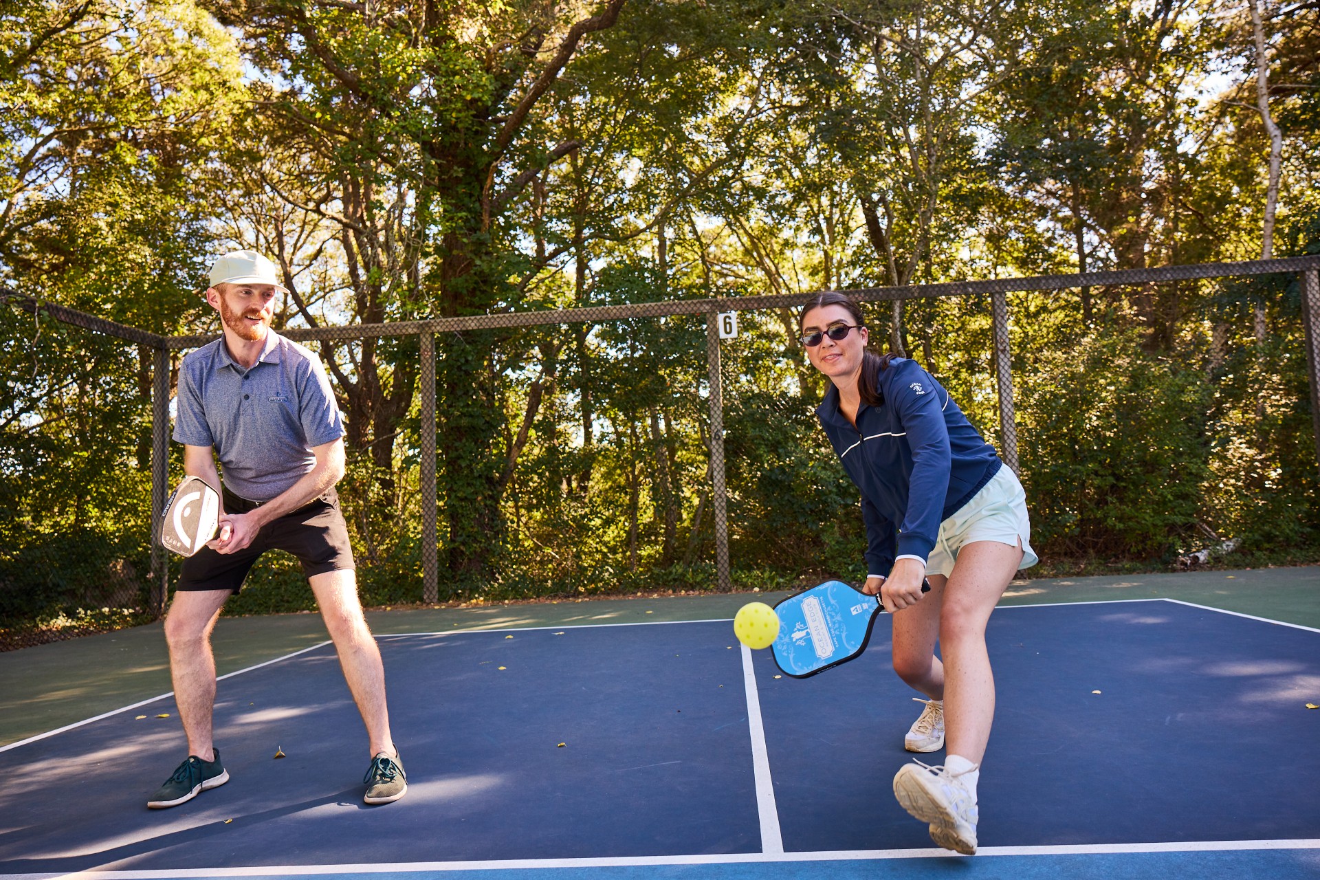 a man and woman playing pickleball at Ocean Edge