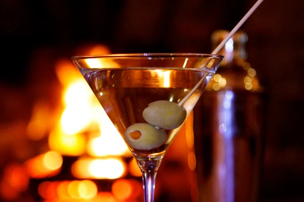 a martini glass with olives in it