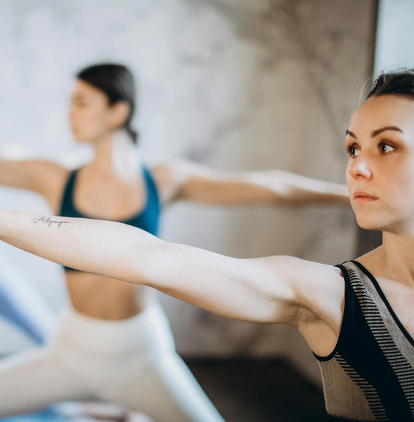 a group of women doing yoga