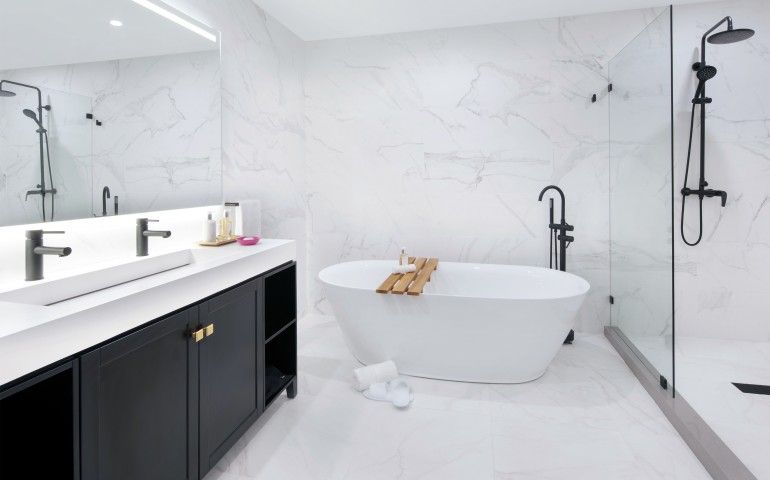 marble bathroom with large white tub