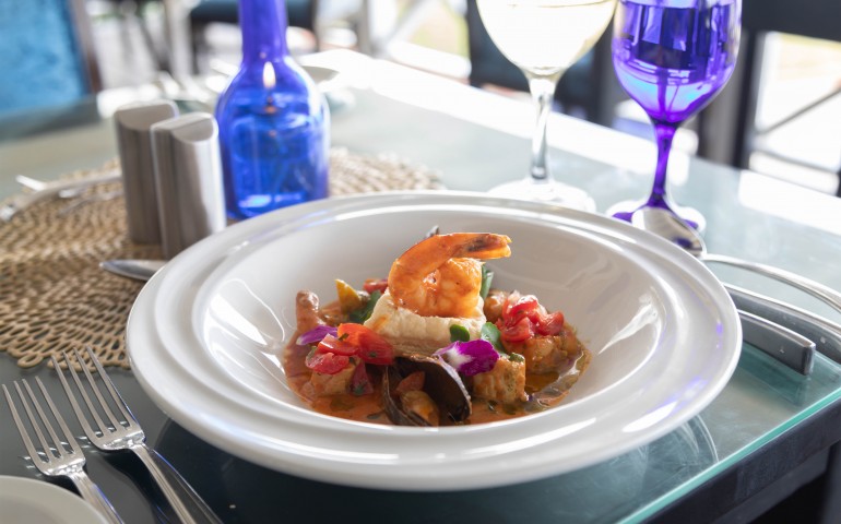 bowl with seafood and a broth