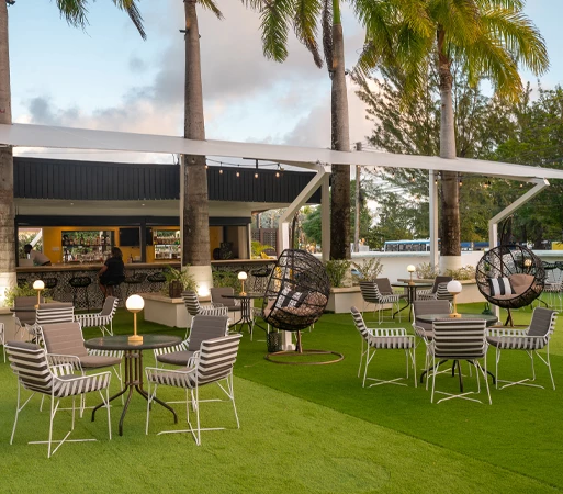 a patio area with chairs and tables