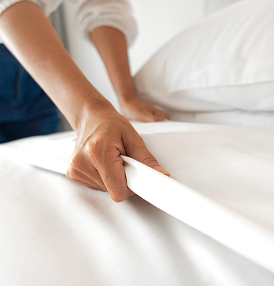 person making a bed