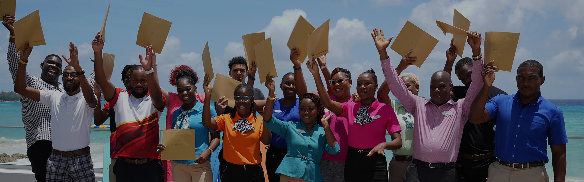 a group of people holding papers