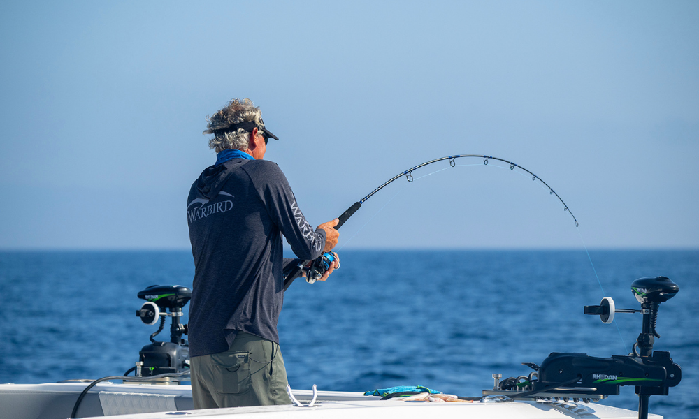 a man fishing on a boat