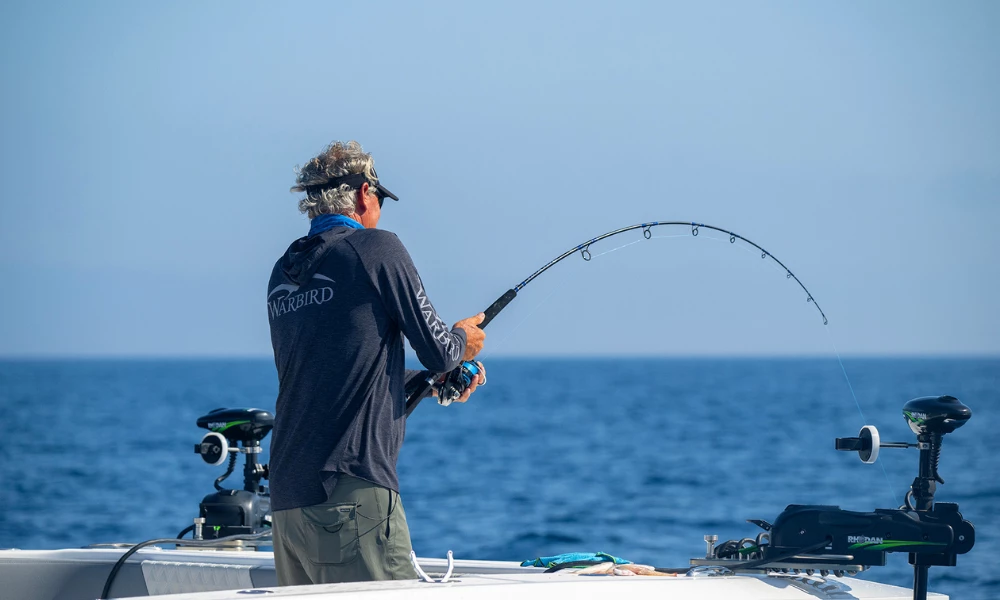 a man fishing on a boat