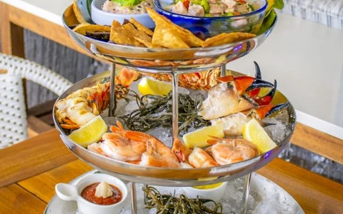 a three tiered tray of food