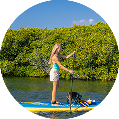 a woman on a paddle board