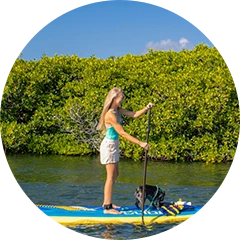 a woman on a paddle board