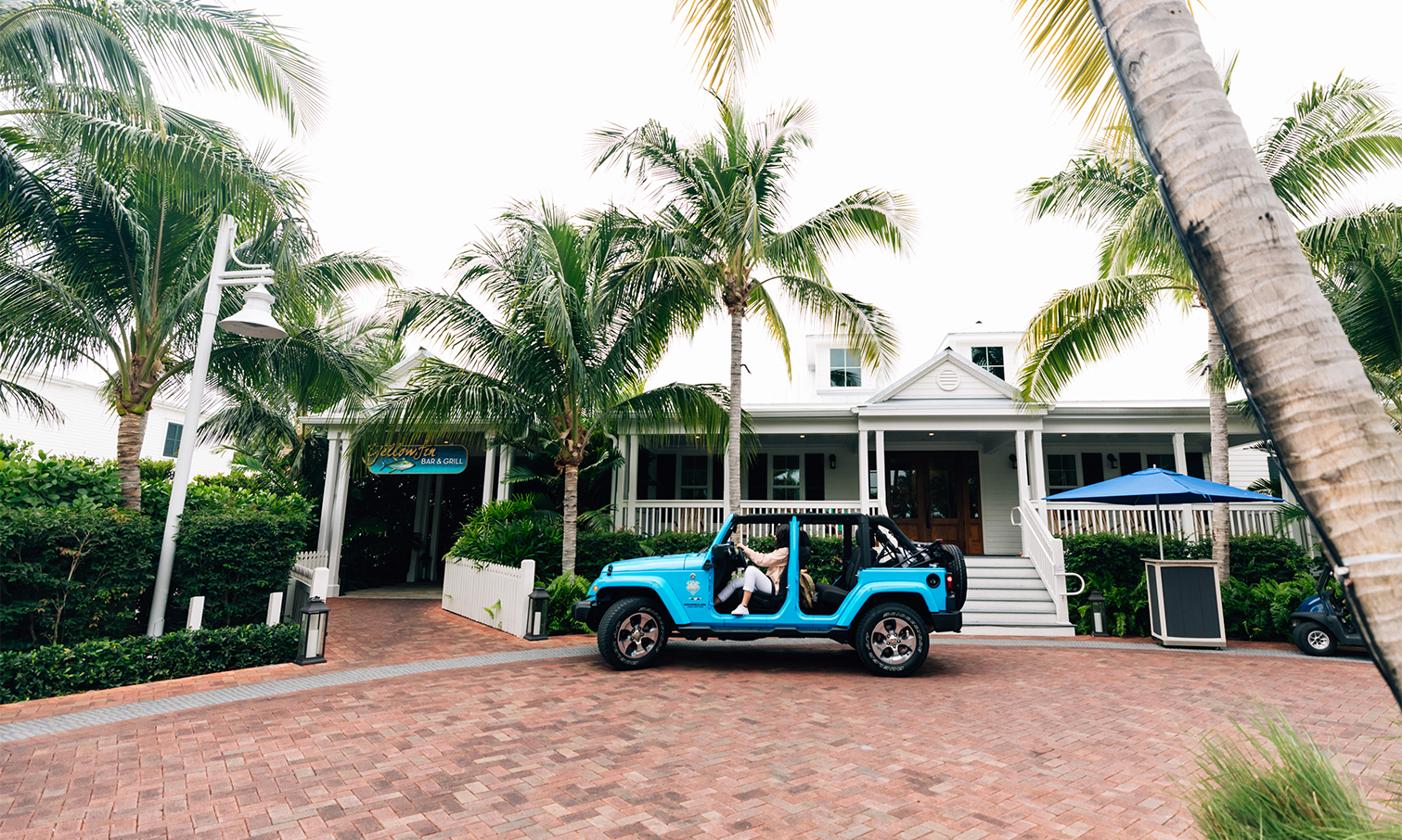 a person in a blue jeep