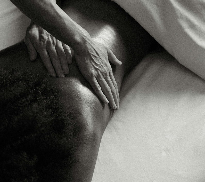 a person's hand on a person's back