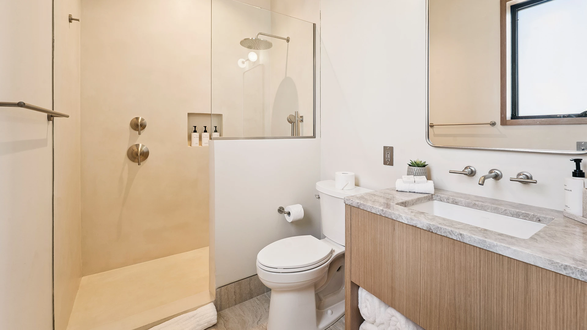 a bathroom with a glass shower door