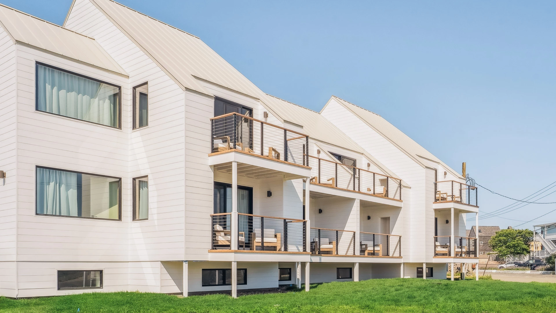 a white building with a lawn