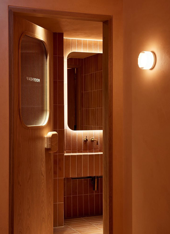 a bathroom with a mirror and a sink