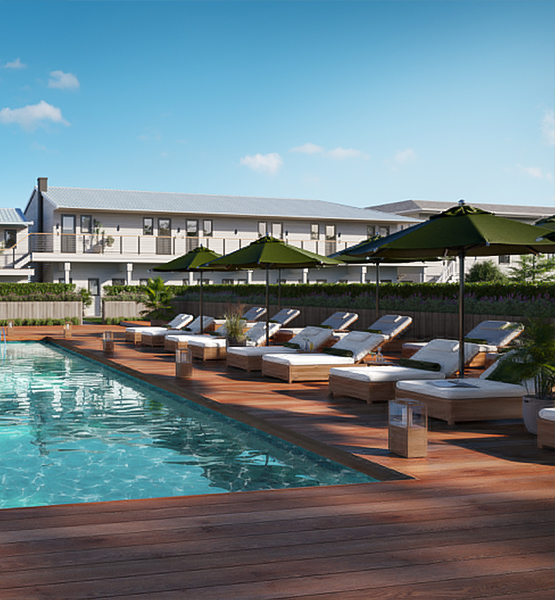 a pool with lounge chairs and umbrellas