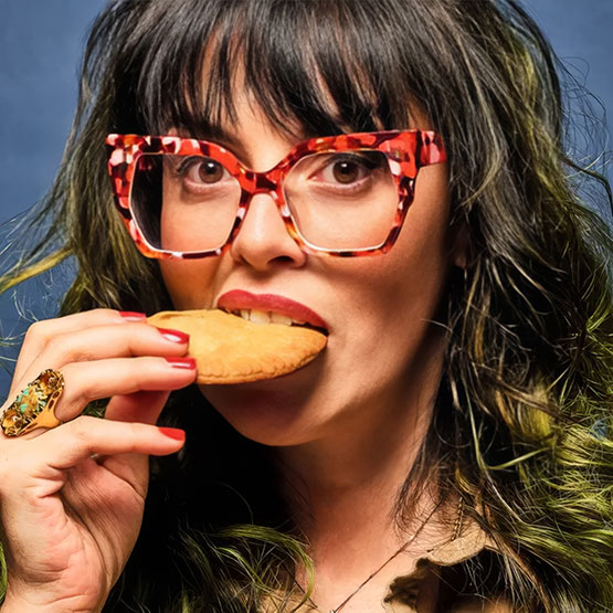 a woman eating a cookie