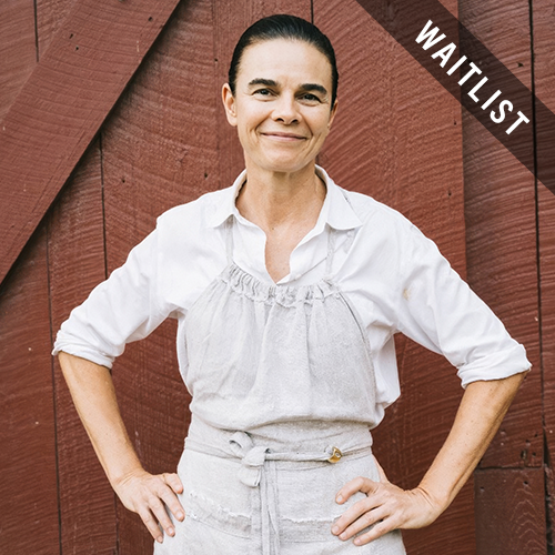 a woman standing with her hands on her hips