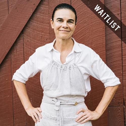 a woman standing with her hands on her hips