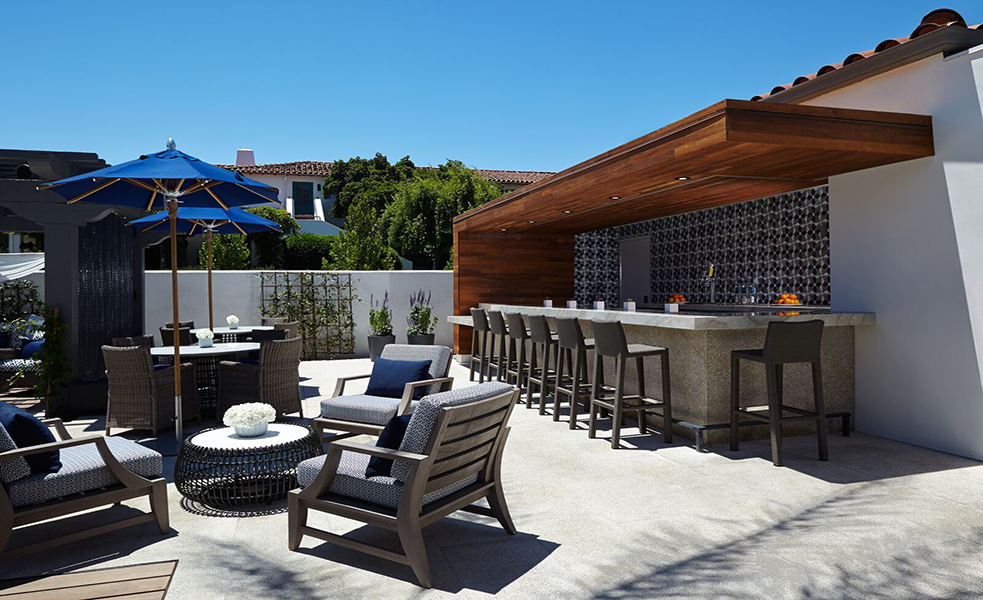 a patio with chairs and tables