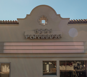 a building with a sign on the top