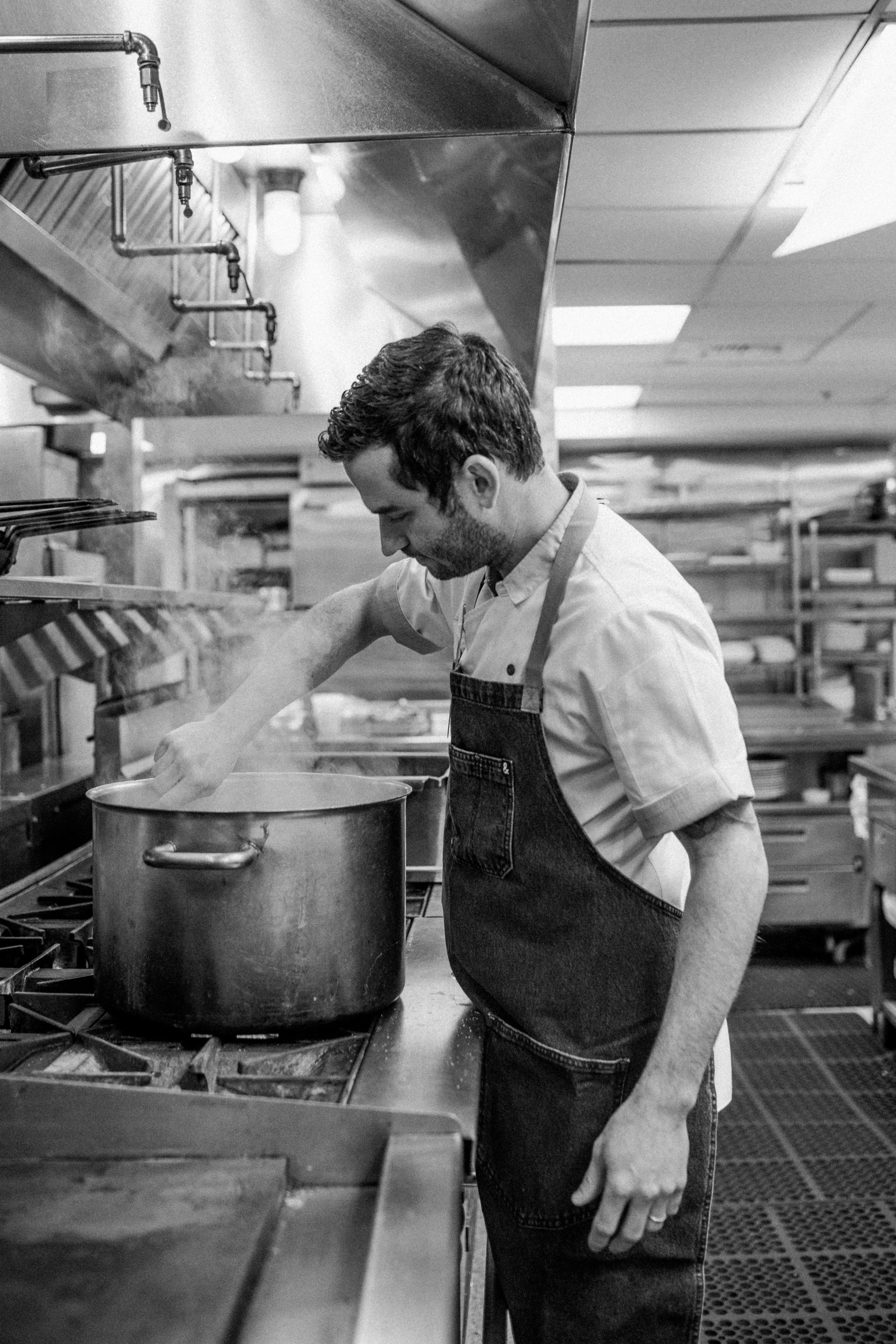 a man cooking in a kitchen