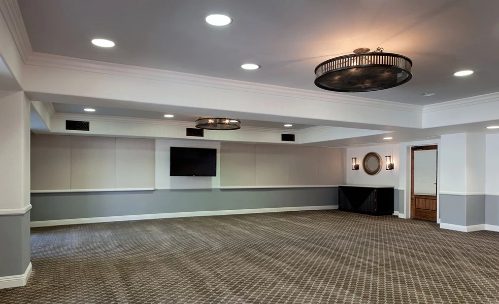 a room with a television and a wall