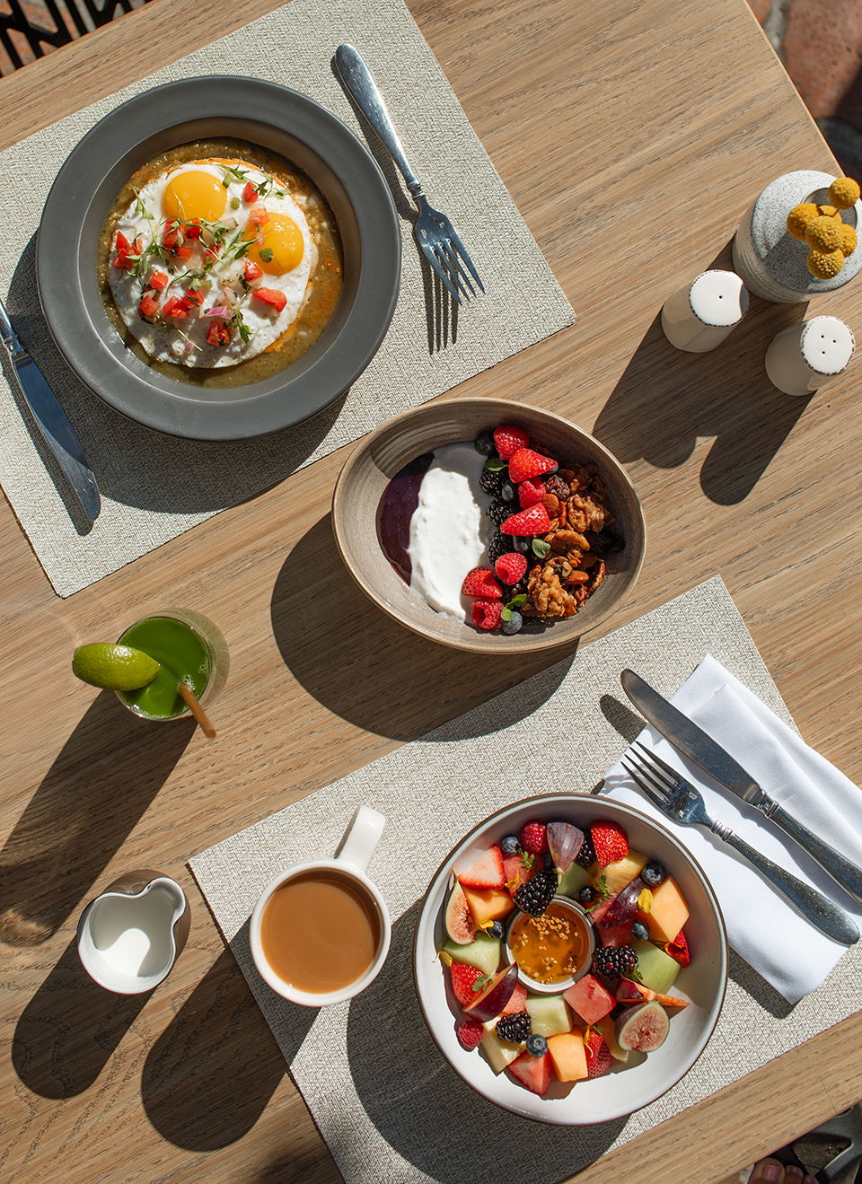 a table with plates of food and a fork and knife