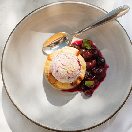 a bowl of dessert with a spoon