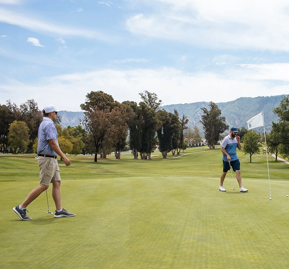 a group of men playing golf