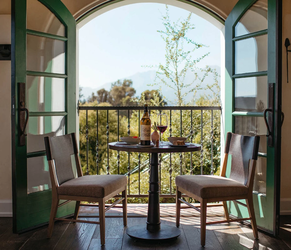 a table and chairs on a balcony