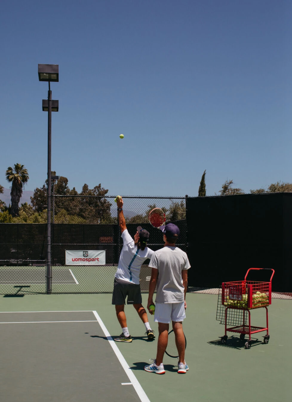 a couple of men playing tennis