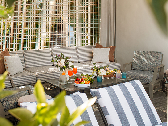 a table with fruit and drinks on it