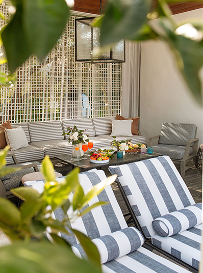 a patio with a table and chairs
