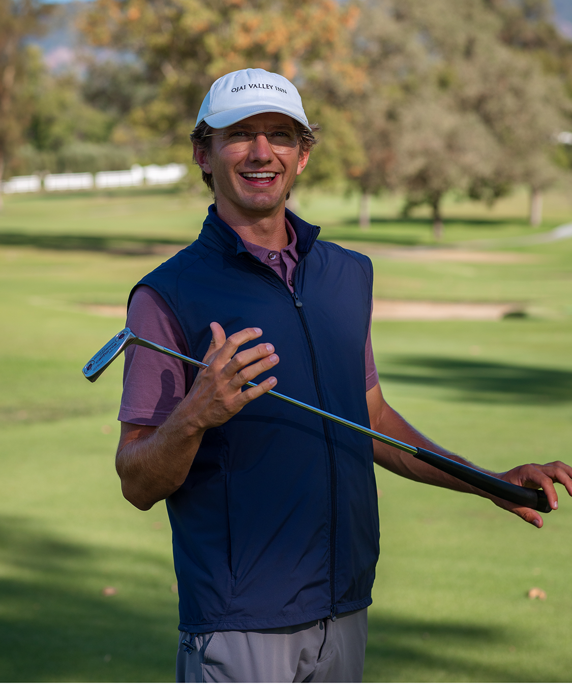 a man holding a golf club