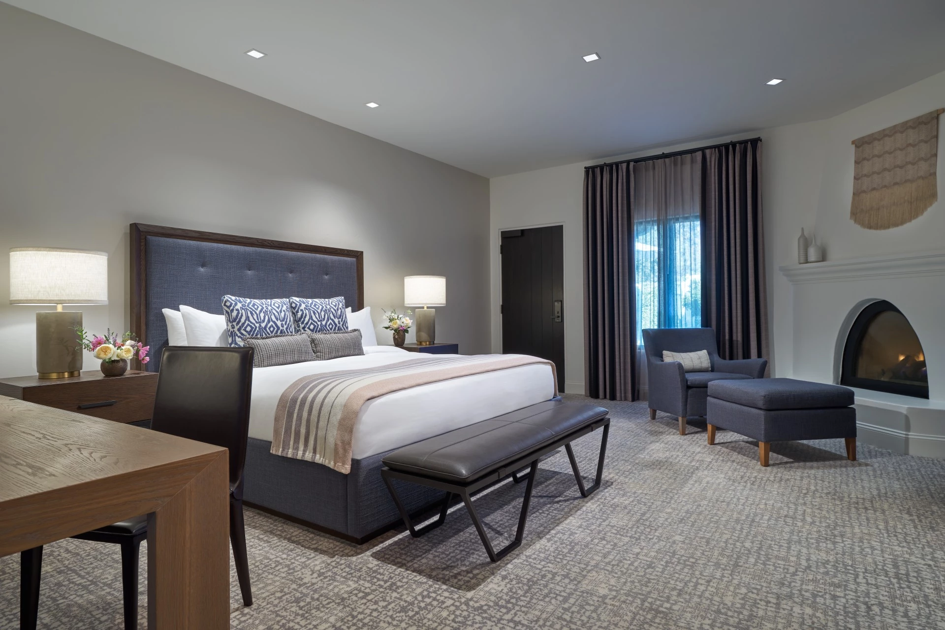 a bedroom with a bed and a chair