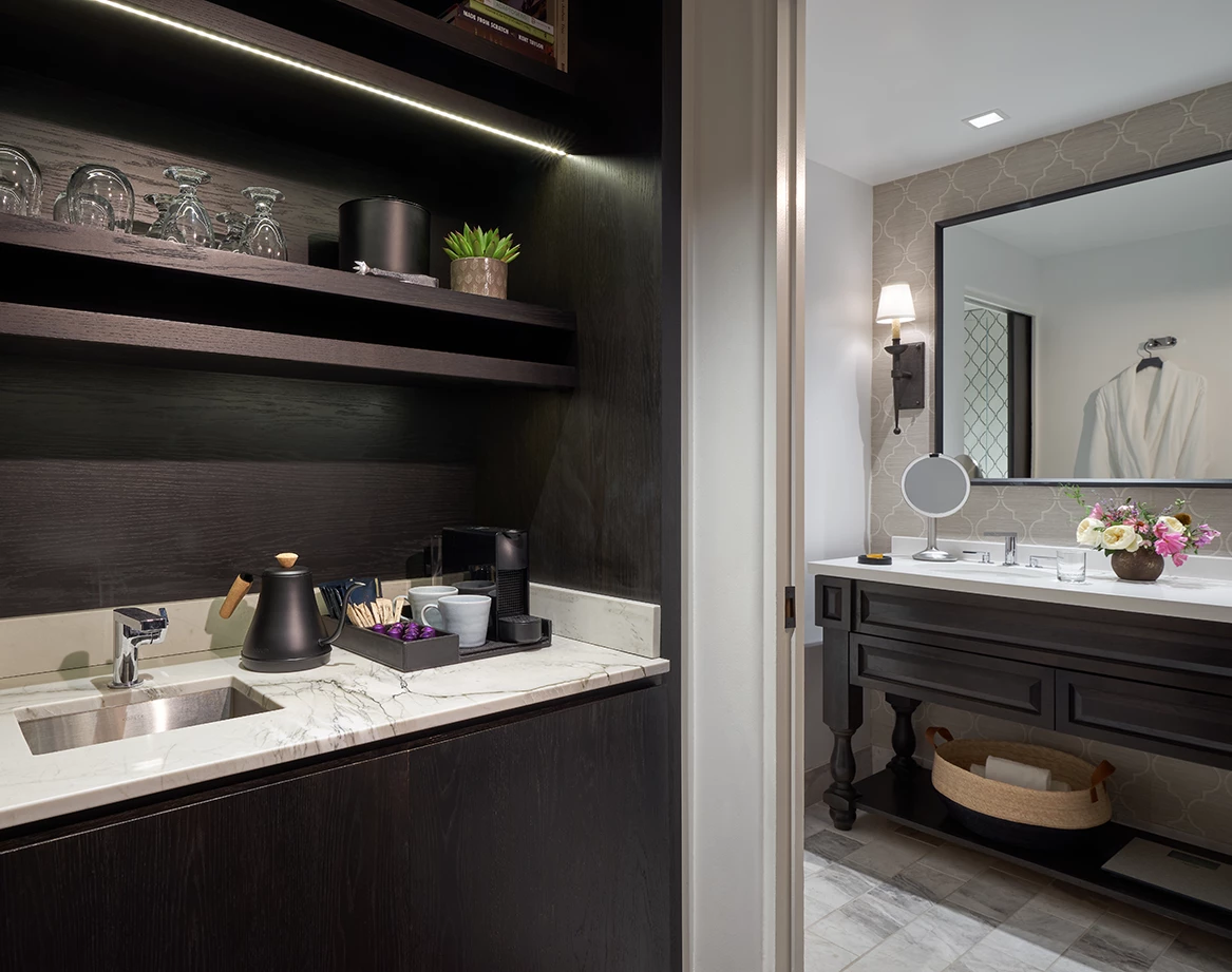a bathroom with a sink and shelves