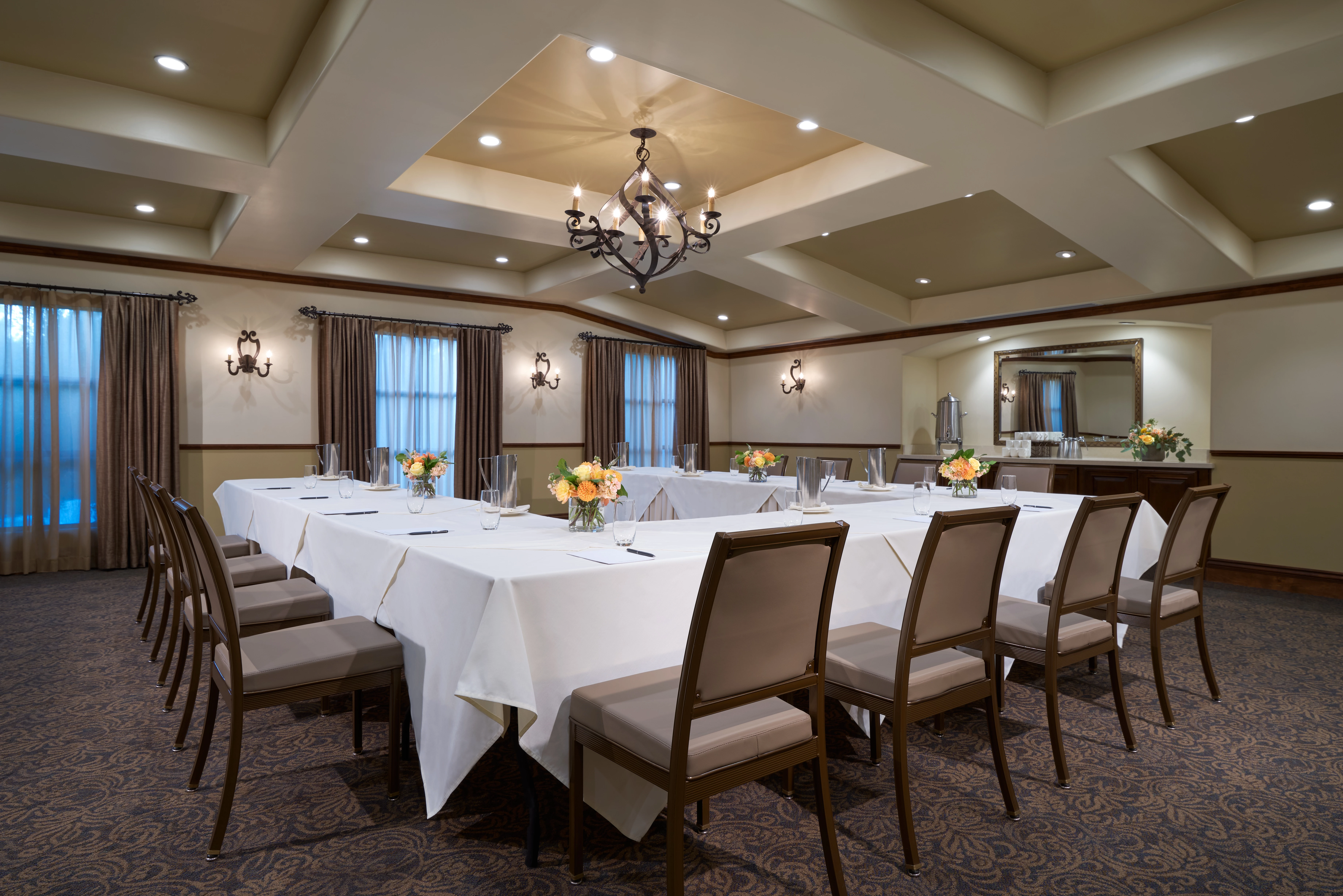 a large room with a large table set for a meeting