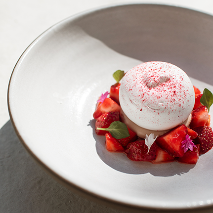 a plate of food with strawberries and ice cream