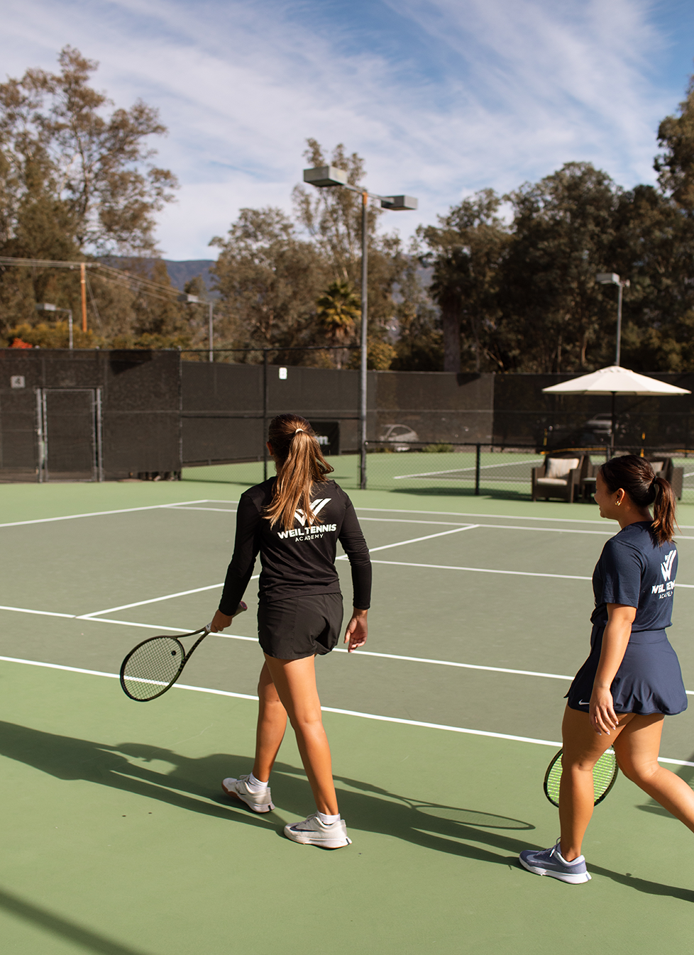 two women on a tennis court