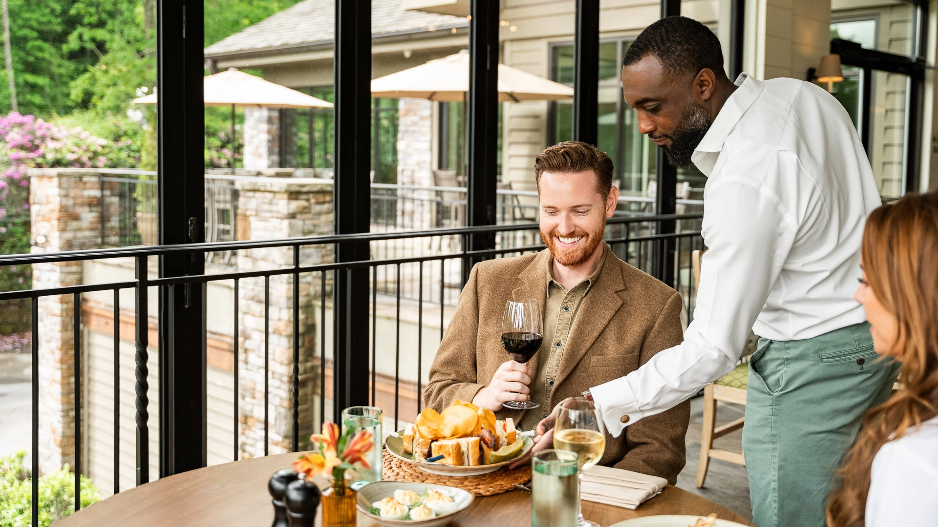 a man holding a glass of wine