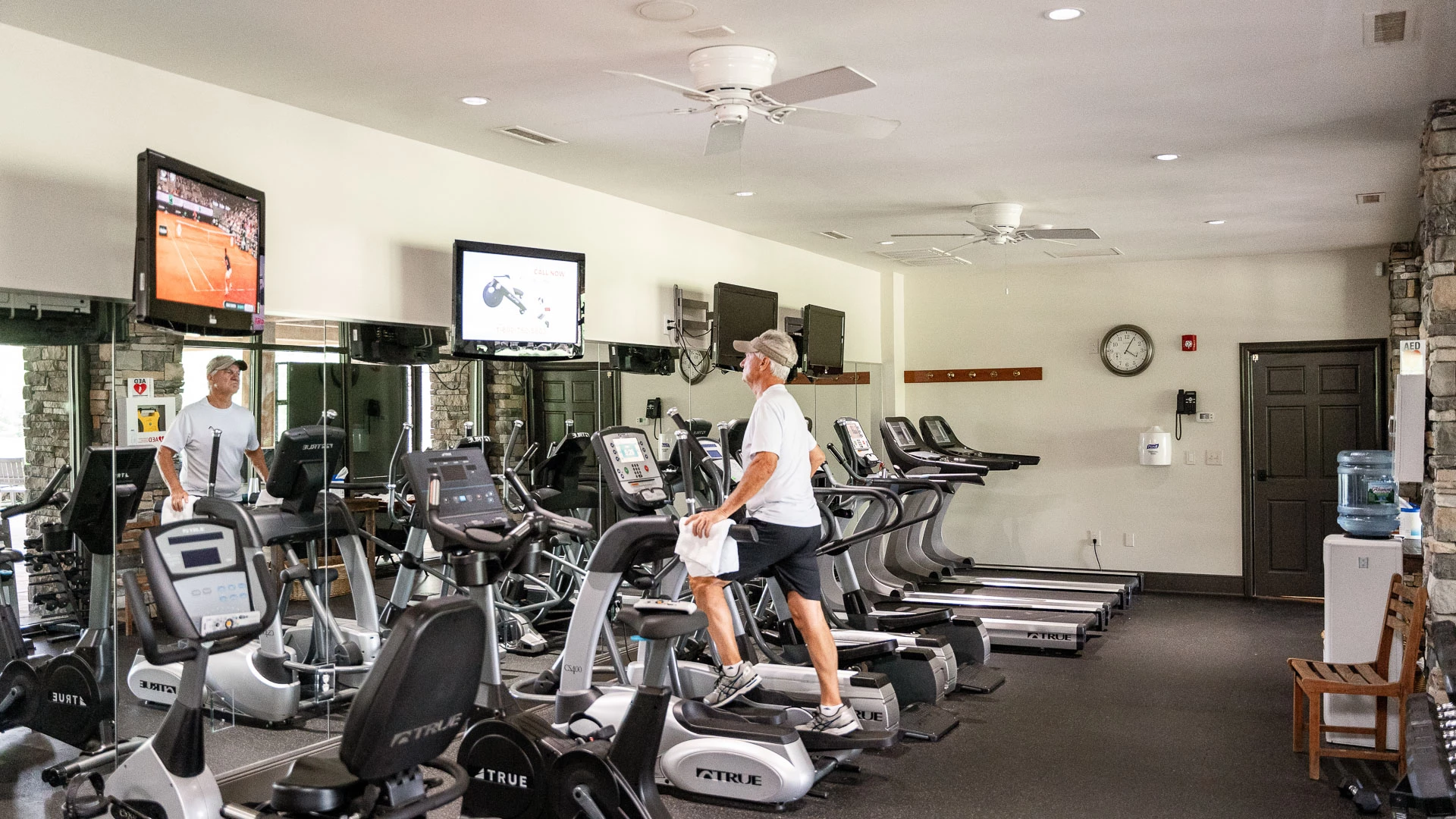 a man on a treadmill in a gym