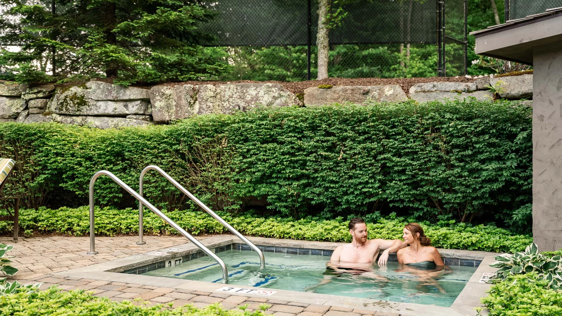 a man and woman in a pool
