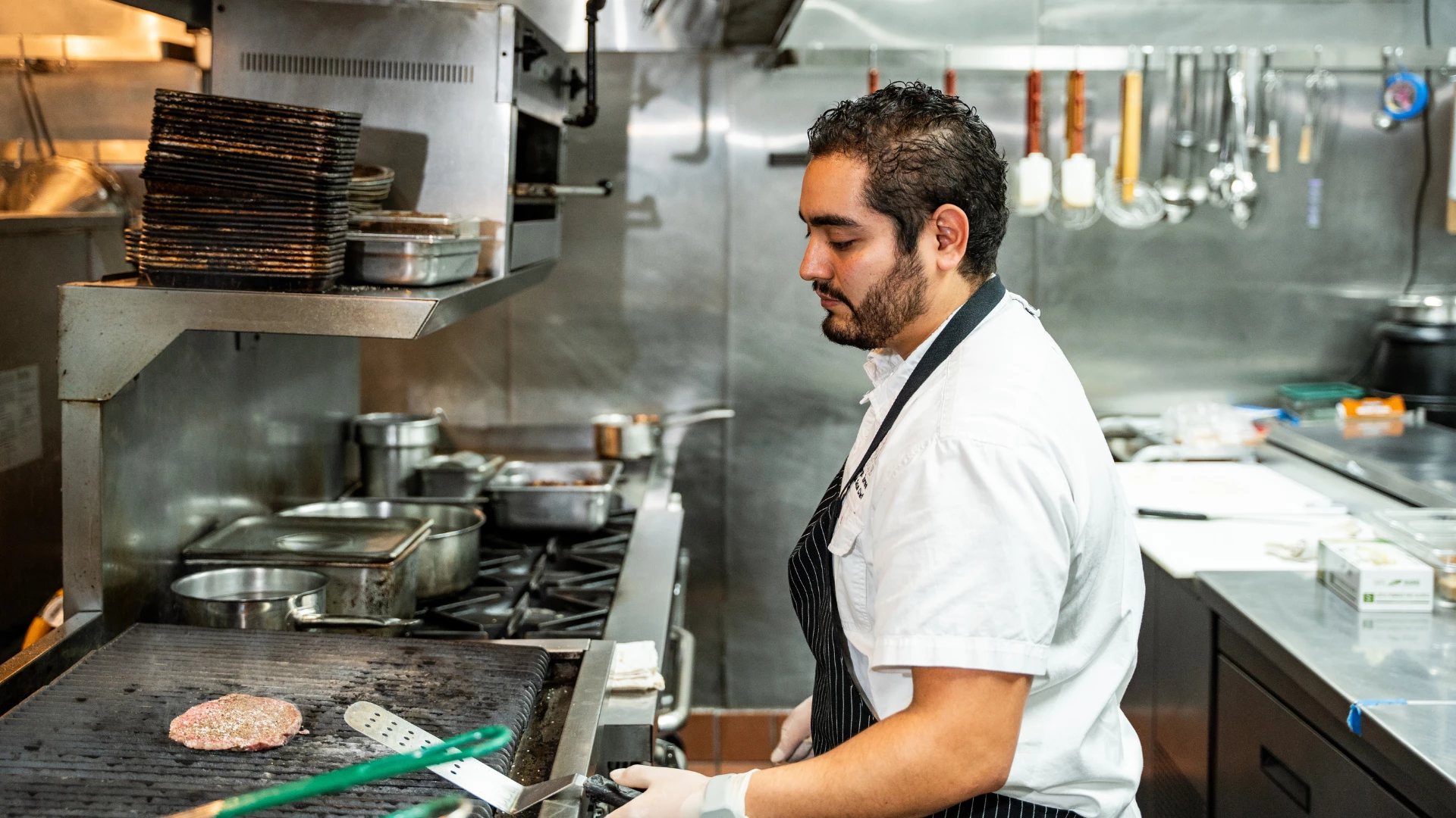 a man in a kitchen cooking