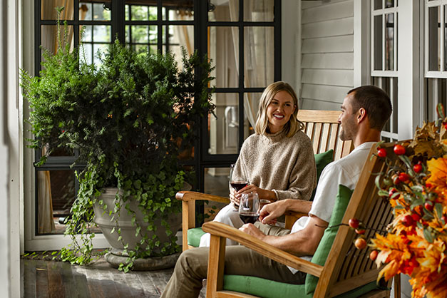 a man and woman sitting on chairs