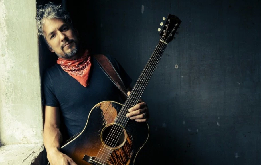 a man holding a guitar