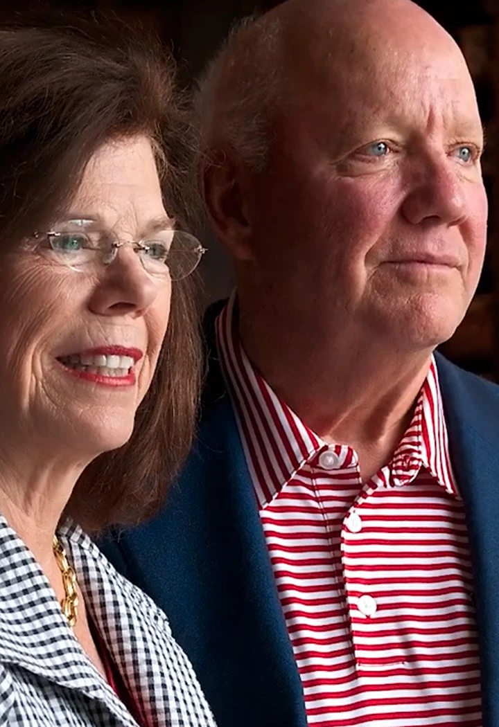 a man and woman smiling