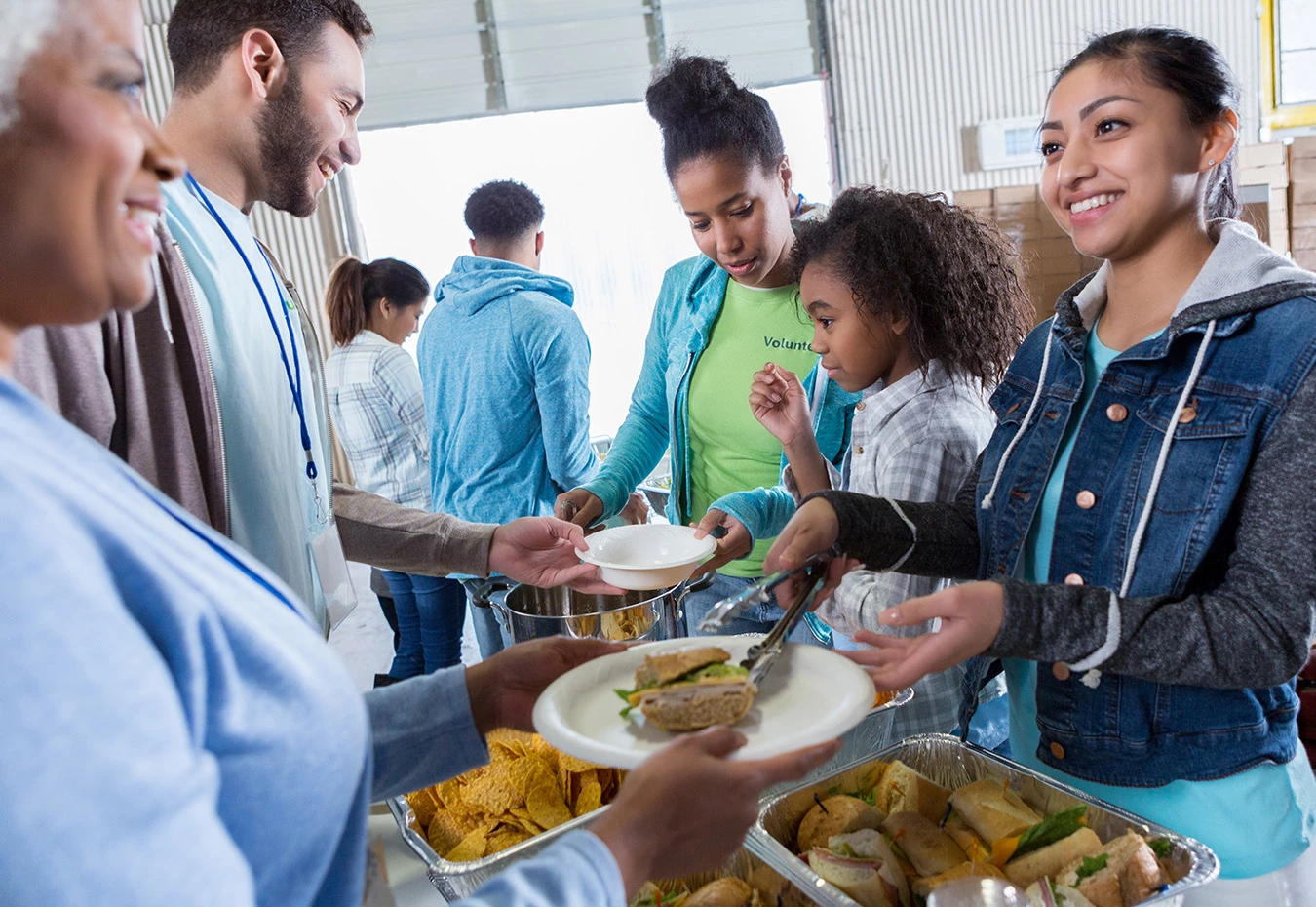 a group of people serving food