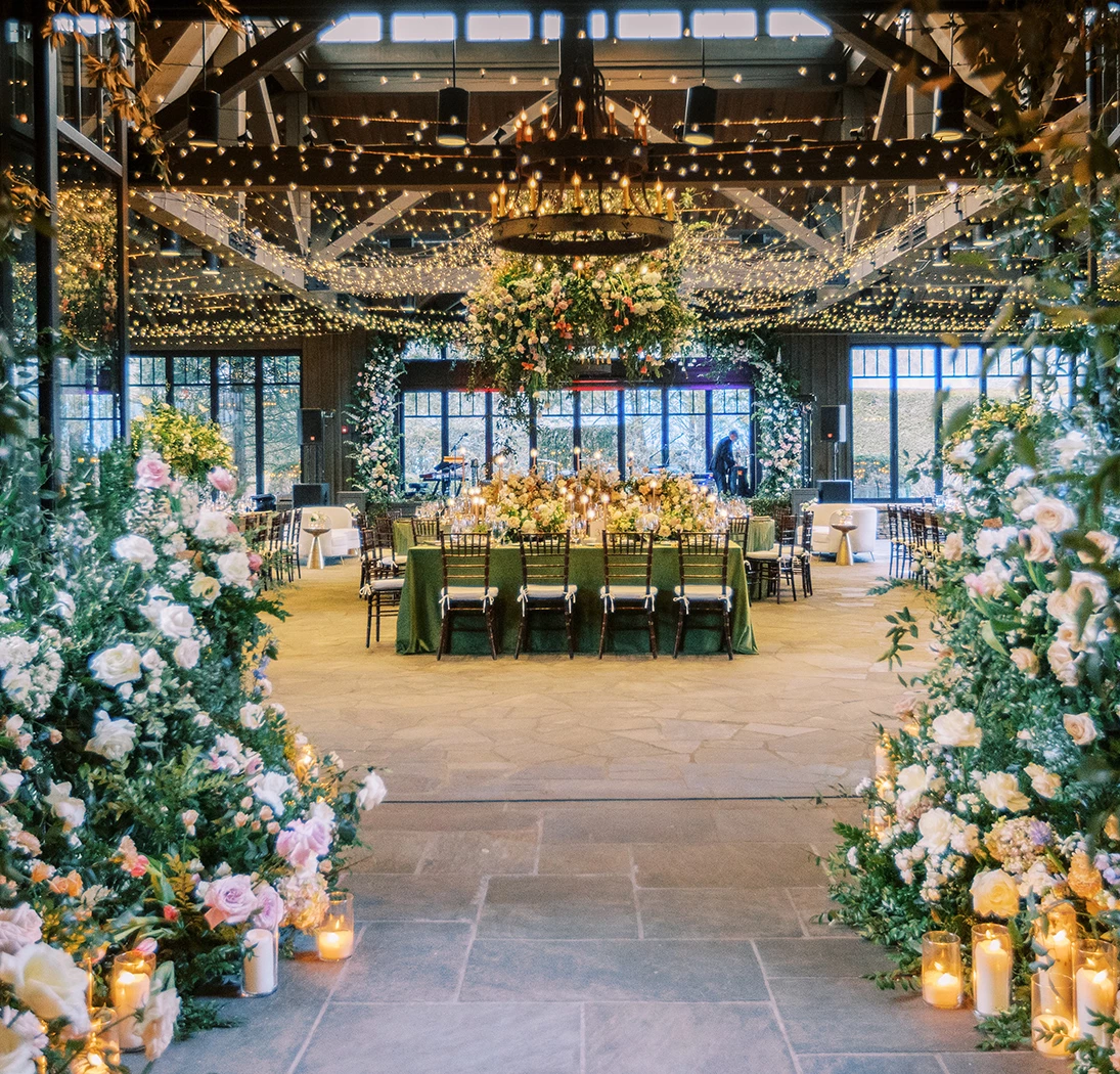 a room with flowers and candles