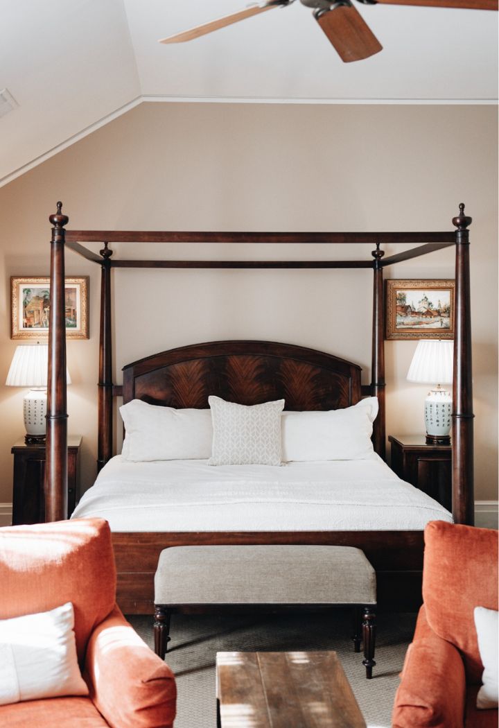 a bed with a four poster bed